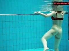 Tattooed baby swirls underwater