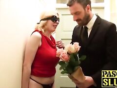 Busty sub has a rose in her mouth and a dick up her pussy