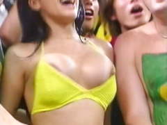 Brazilian soccer fan bounces big tits and nipple pops out
