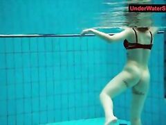 Tattooed baby swirls underwater