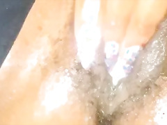 Juicy ebony plays with her fat pussy and squirts
