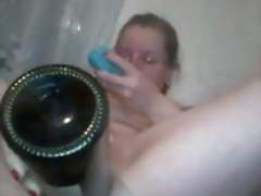 Natalia fucks herself with a bottle and vibrator