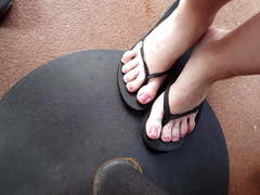 Recording aunt's feet in flip flops under the table
